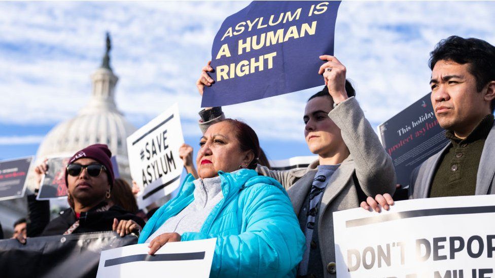 Activists outside the Capitol urge the White House to reject Republican proposals for the border
