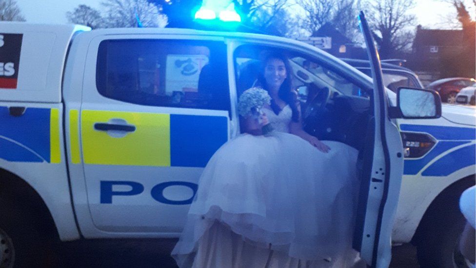 Bride in the police car
