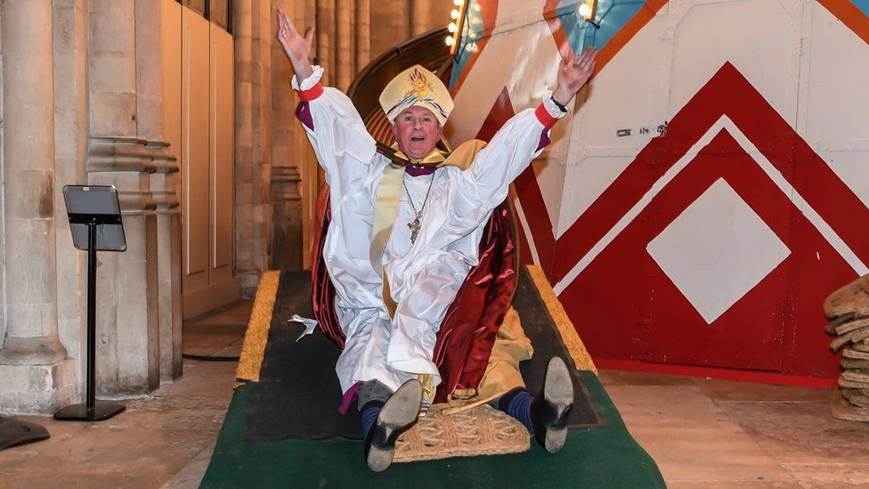 The Bishop of Lynn, the Rt Revd Jonathan Meyrick uses the slide
