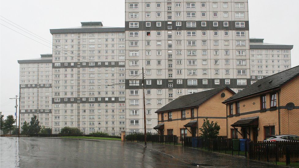 Flats next to houses on street