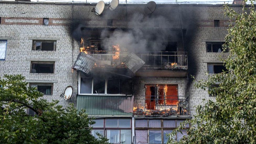 A burning apartment block hit by Russian fire in Siversk, eastern Ukraine, 8 Jul 22