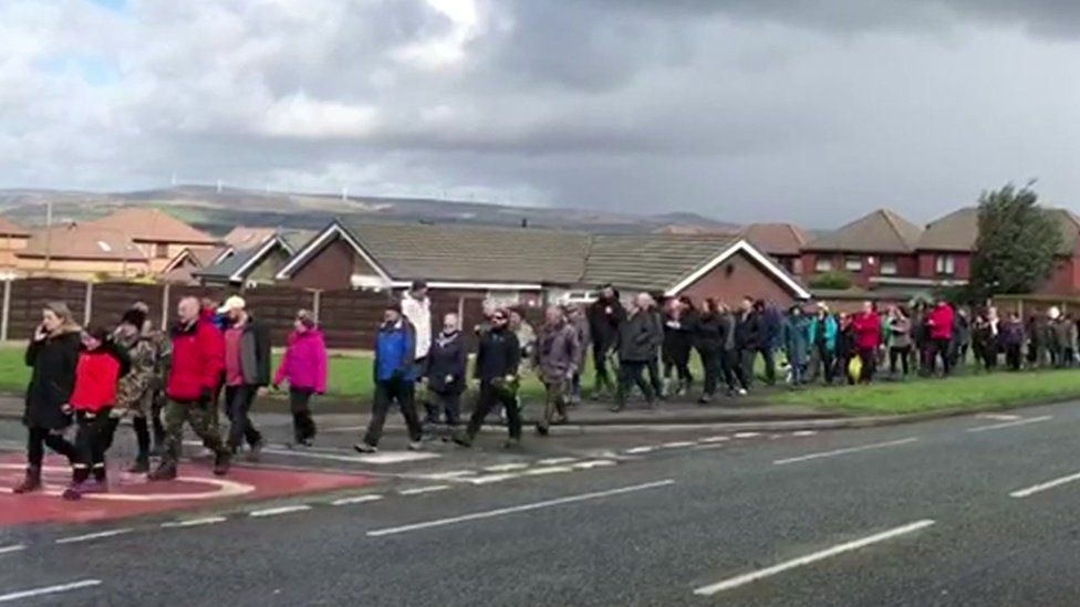 people marching through Bury