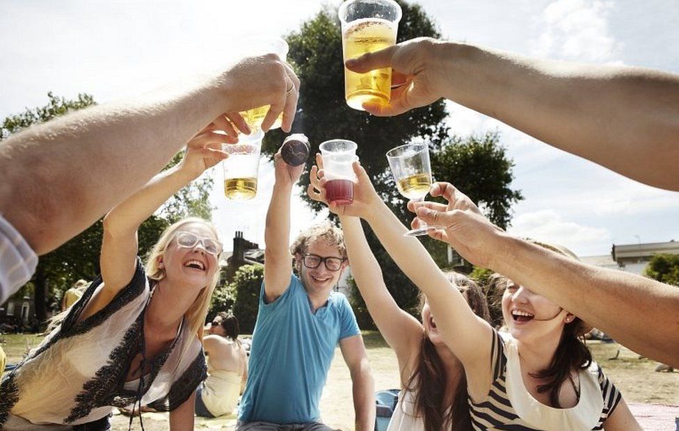 Friends drinking in the park