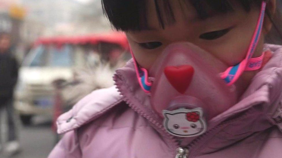 Girl wearing anti-pollution mask