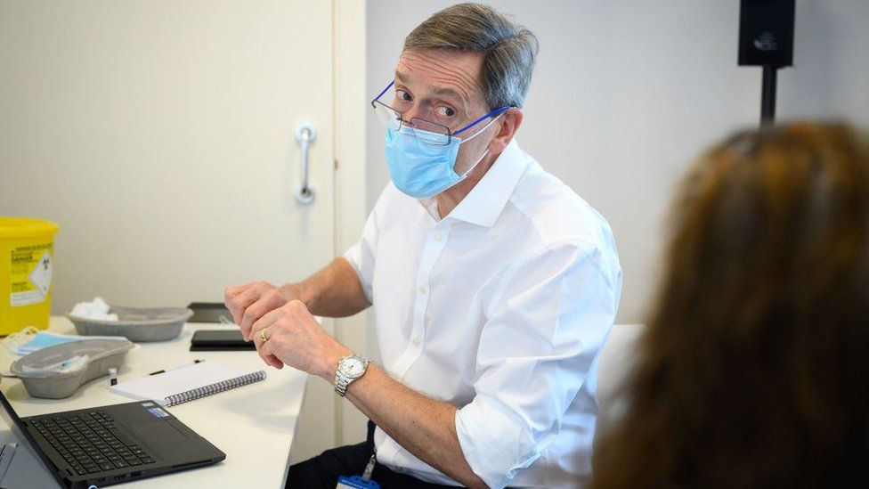 Prof Martin Marshall at a vaccine clinic at the Sir Ludwig Guttmann Health and Wellbeing Centre in east London