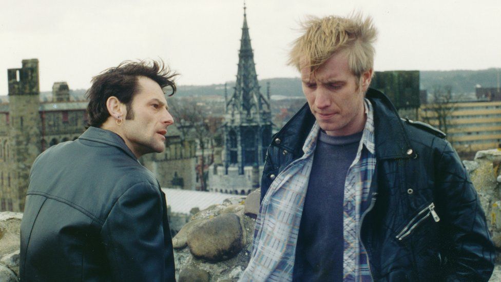 Rhys Ifans (right) in Rhag Pob Brad, a TV play about the 25th anniversary of the Prince of Wales' Investiture. 25 years on and was broadcast on S4C in July, 1994