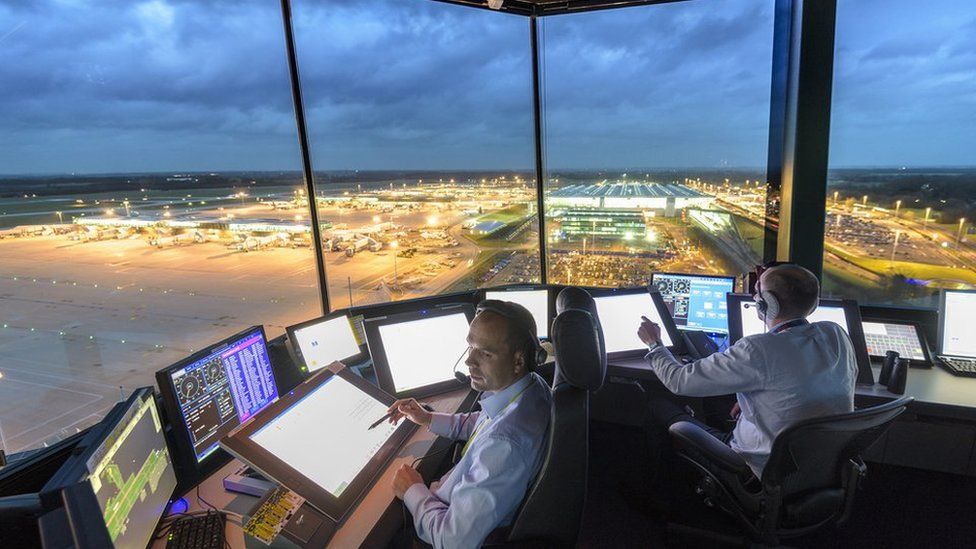 Controllers in the tower at Stansted Airport
