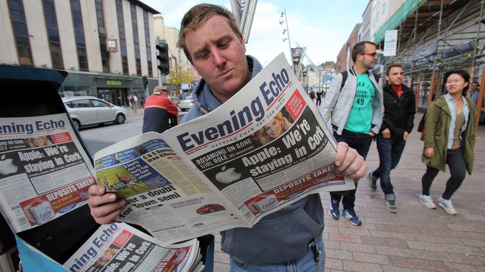 Man reading paper in Ireland