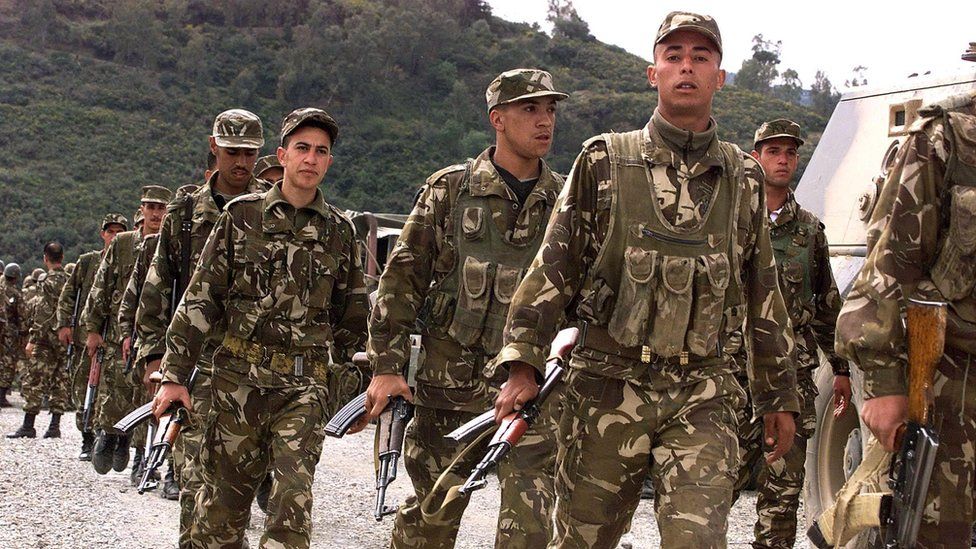 algerian soliders in 2001 following islamist massacre