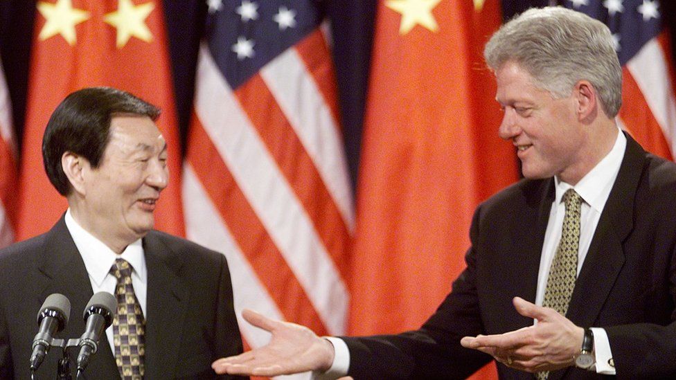 President Bill Clinton gestures to Chinese Prime Minister Zhu Rongji at the conclusion of a joint press conference 08 April 1999.