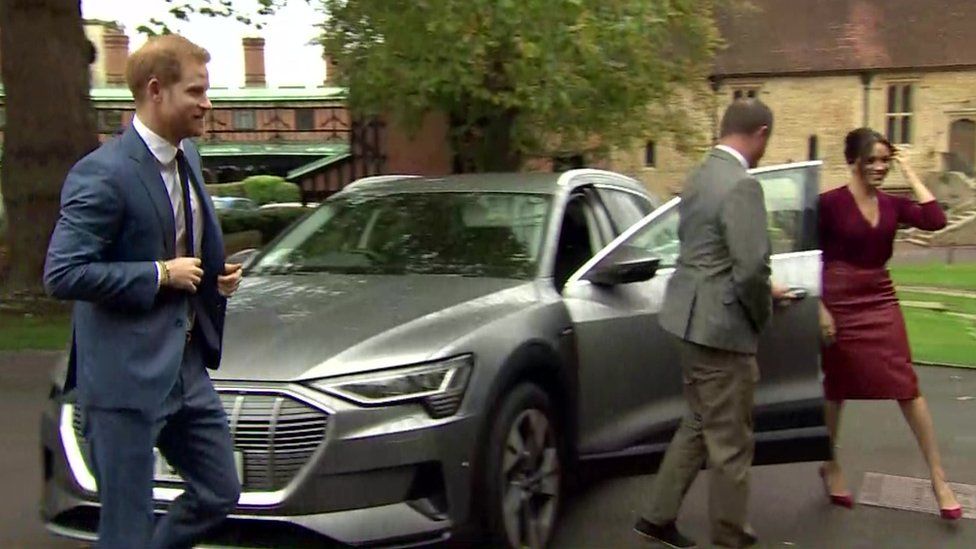 The Duke and Duchess of Sussex get out of their car as they arrive at the roundtable