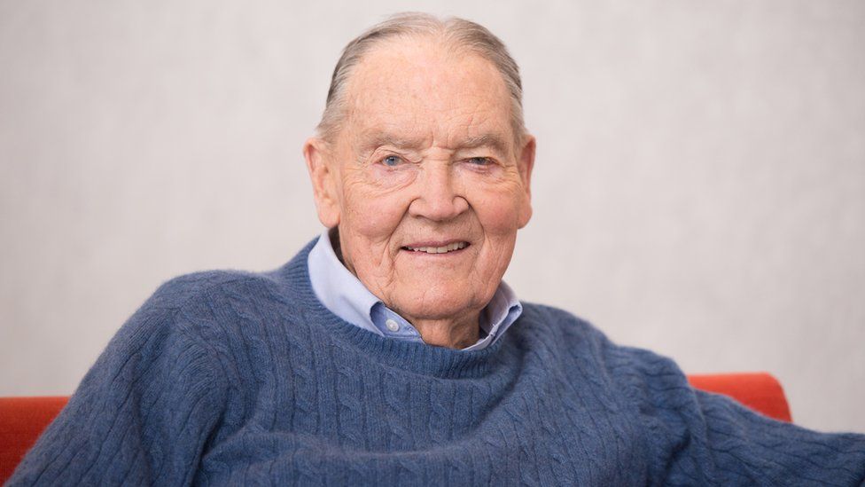 John Bogle sitting and smiling