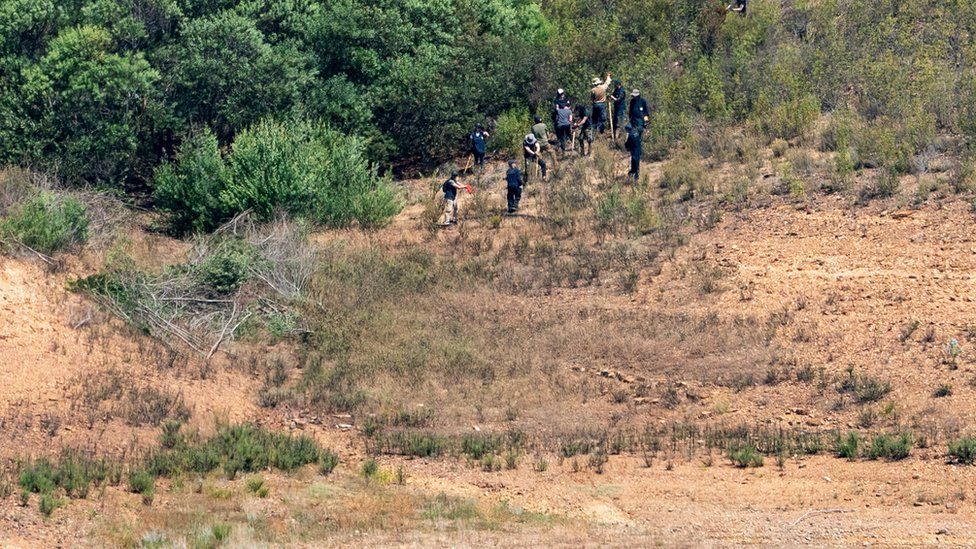 Police officers are seen astatine  the tract  of a distant    reservoir successful  The Algarve, Portugal, wherever  a hunt  is underway for grounds  related to the disappearance of Madeleine McCann