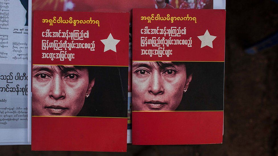 Booklets bearing Aung San Suu Kyi's face in Myanmar after her party swept to victory in November 2015's election