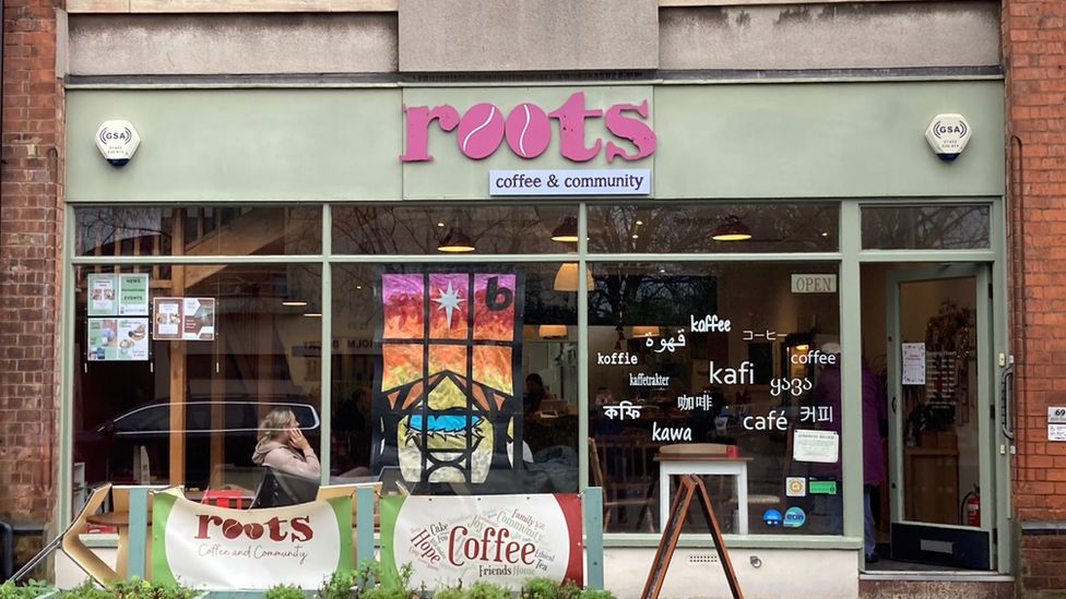 Roots Cafe in Gloucester as soon from the outside with lettering on the windows