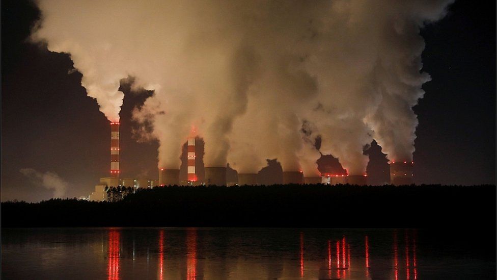 Smoke and steam billows from Belchatow Power Station, Europe's largest coal-fired power plant operated by PGE Group, at night near Belchatow, Poland December 5, 2018