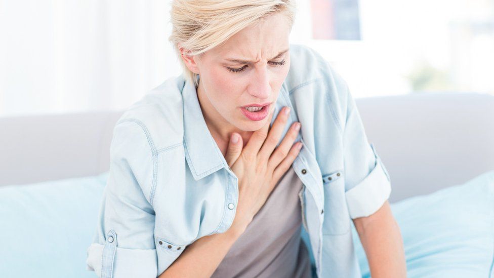 Woman having breathing difficulties