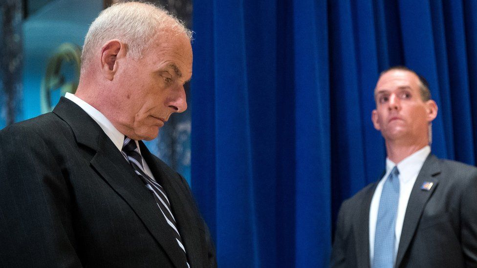 John Kelly (left) looks on as Trump holds his news conference in Trump Tower on 15 August 2017