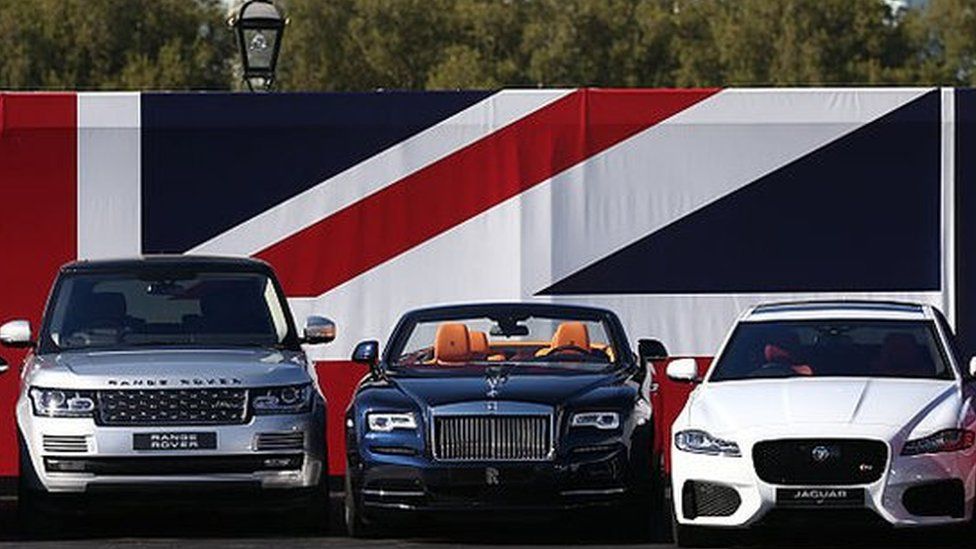 Cars in front of union jack flag