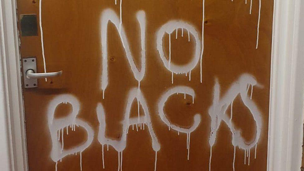 "No Blacks" graffiti daubed on door