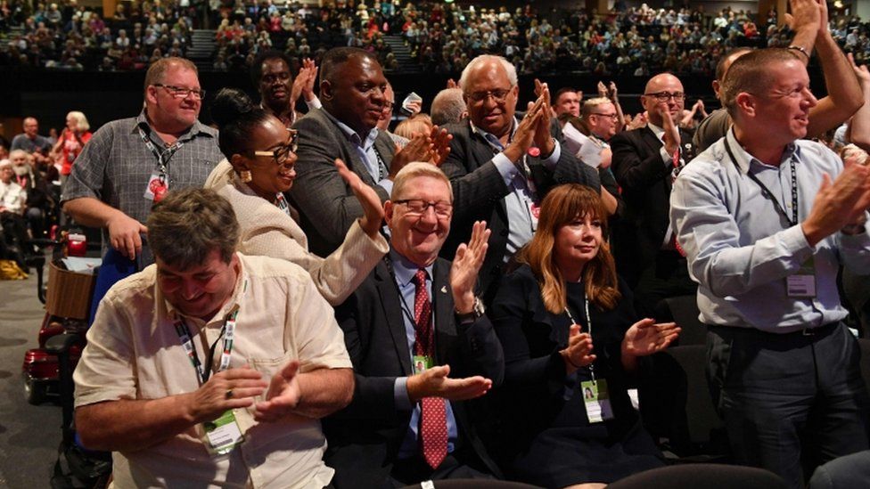 Len McCluskey and other delegates following voting