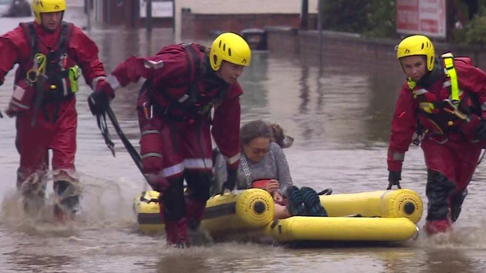A woman is rescued in Chesterfield, Derbyshire, on Friday