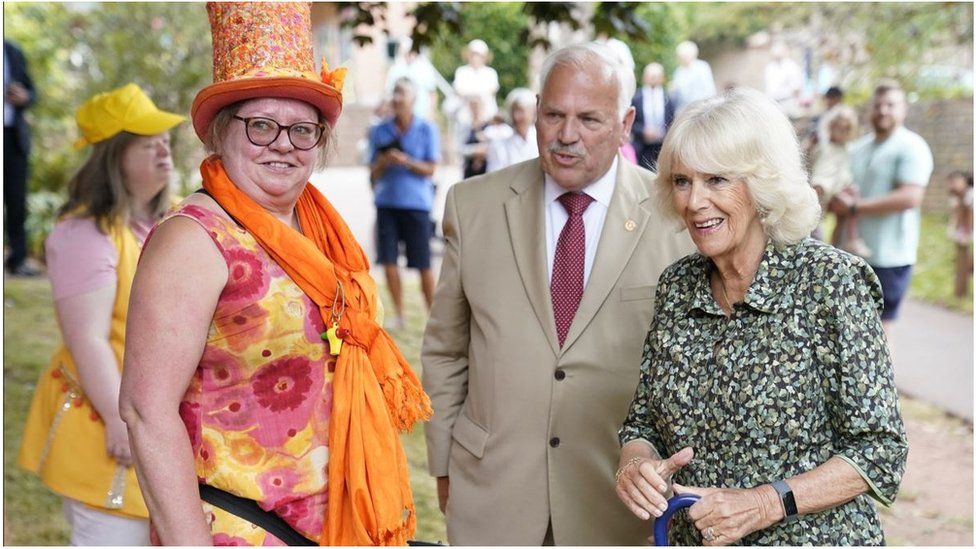 The Duchess of Cornwall meets members of Samba Roc during a visit to Cockington Court in Torquay