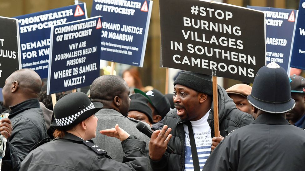 UK police officers speak with demonstrators from Cameroon, London, UK - Monday 9 March 2020