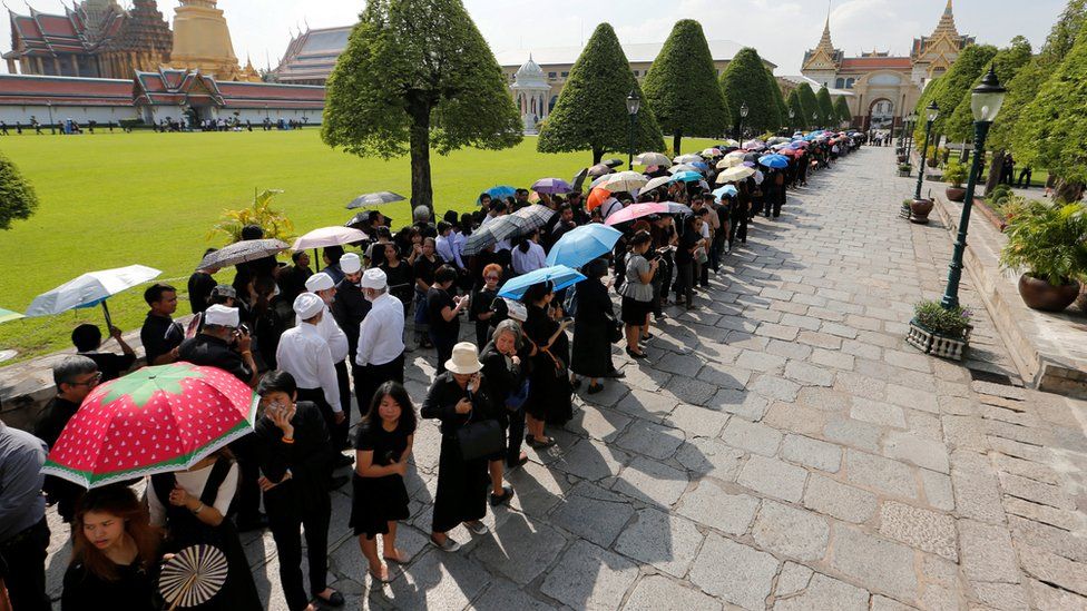 Thai mourners line the streets for the king's funeral procession