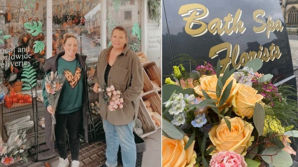 Two women standing outside a florist holding bunches of flowers