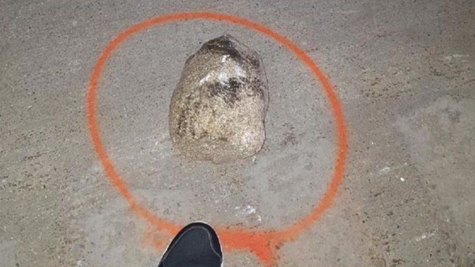 One of 20 rocks found on the highway after the incident