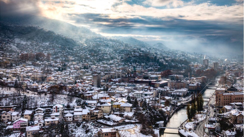 A city landscape of Sarajevo covered in snow