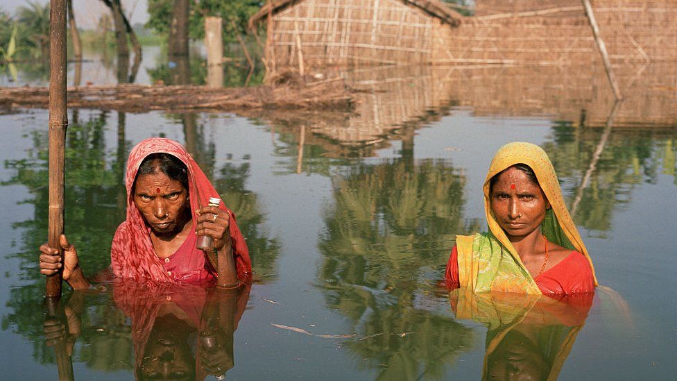 Two women in the village of Salempur near Muzaffarpur which is totally flooded