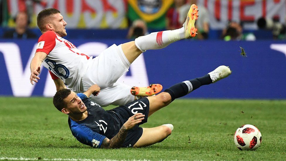 France defender Lucas Hernandez doing a slide tackle at the 2018 World Cup