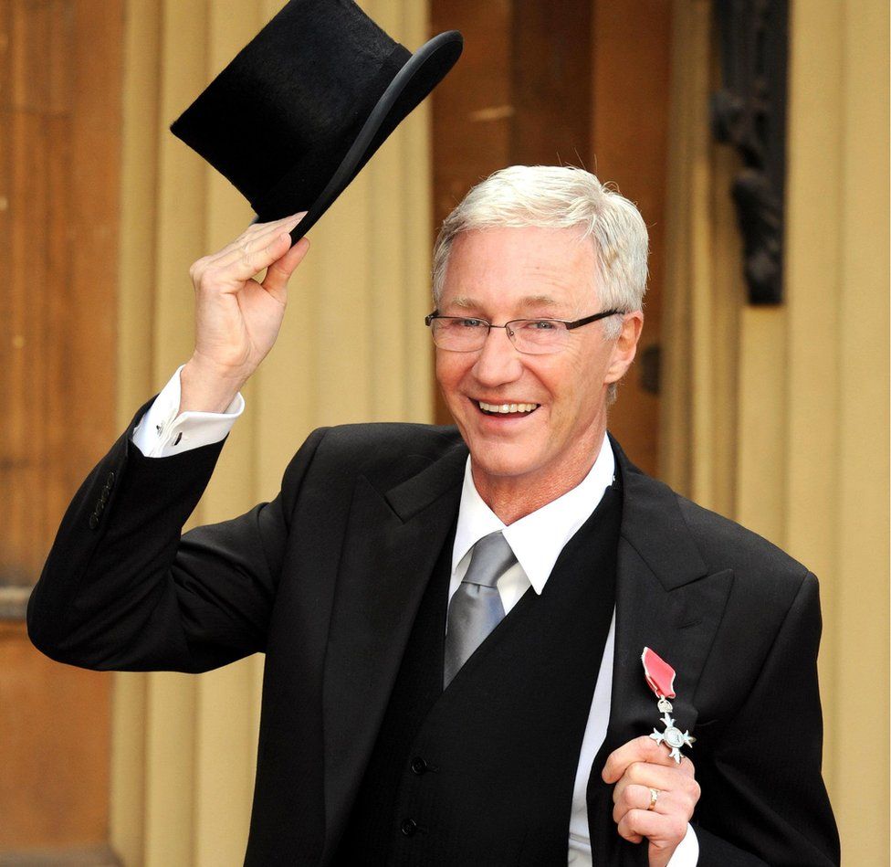 Paul O'Grady at Buckingham Palace, where he was made a Member of the Order of the British Empire by the then Prince of Wales (now King Charles III)