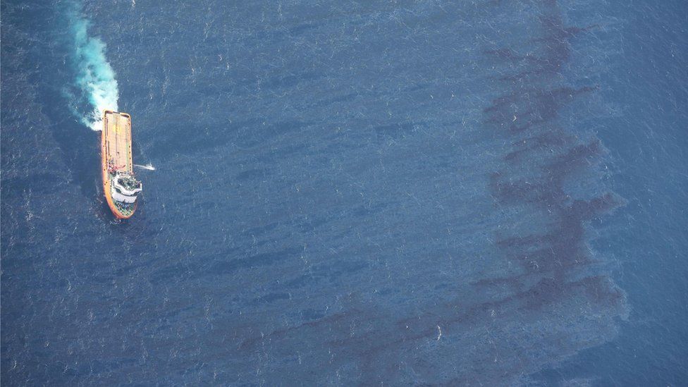 It shows China's offshore supply ship working at the oil spill area during a clean-up operation off the coast of eastern China.