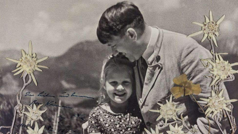 Adolf Hitler hugs Rosa Bernile Nienau in a signed picture