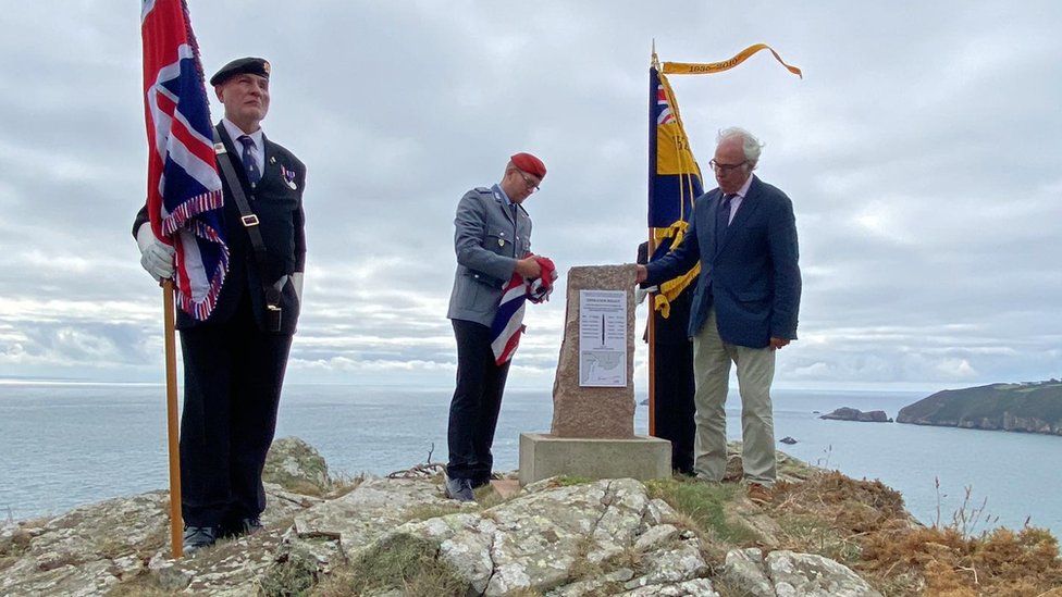 Unveiling of plaques on a memorial stone