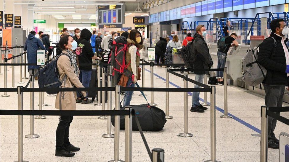 Passengers queuing at passport control