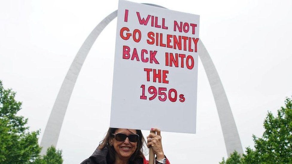 A woman holds up a sign as hundreds of women protest on the steps of the Old Court House during a Stop the Abortion Ban Bill Day of Action in St Louis, Missouri