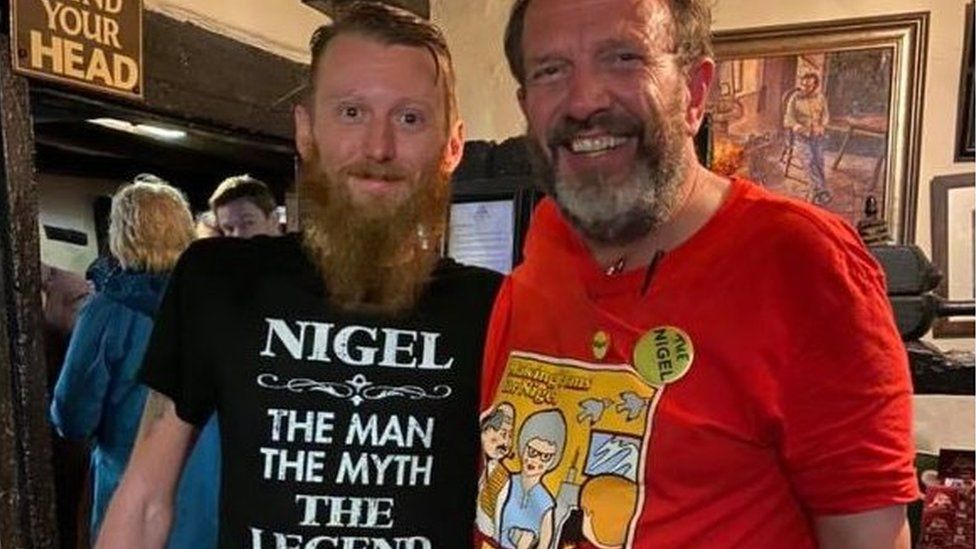 Nigel Smith with a pub goer