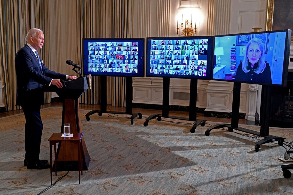 President Biden speaks to dozens of people in a video conference