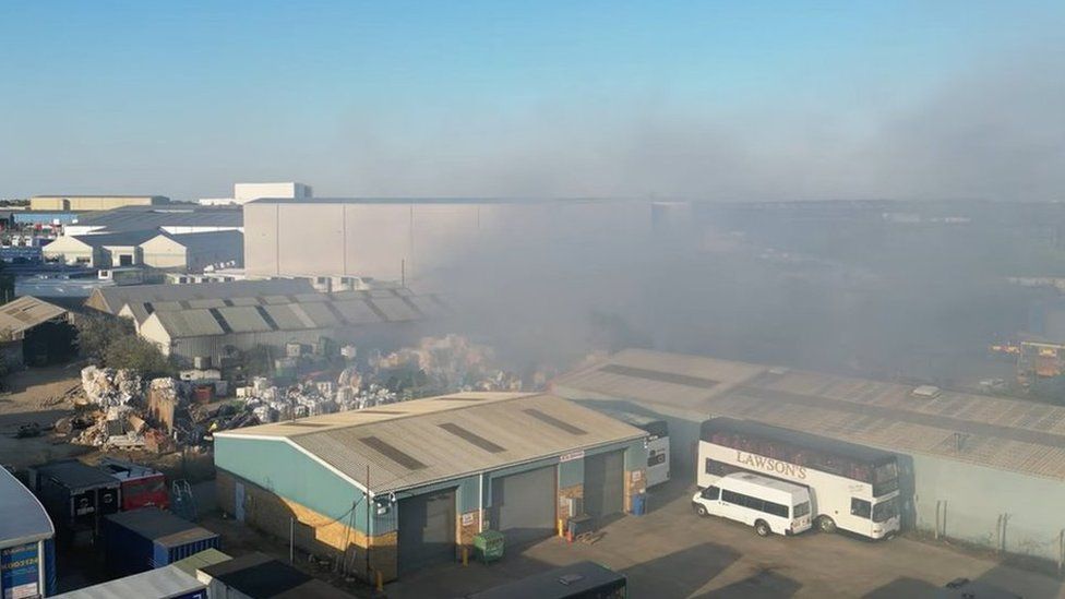 Smoke coming from a fire at a recycling factory in Corby