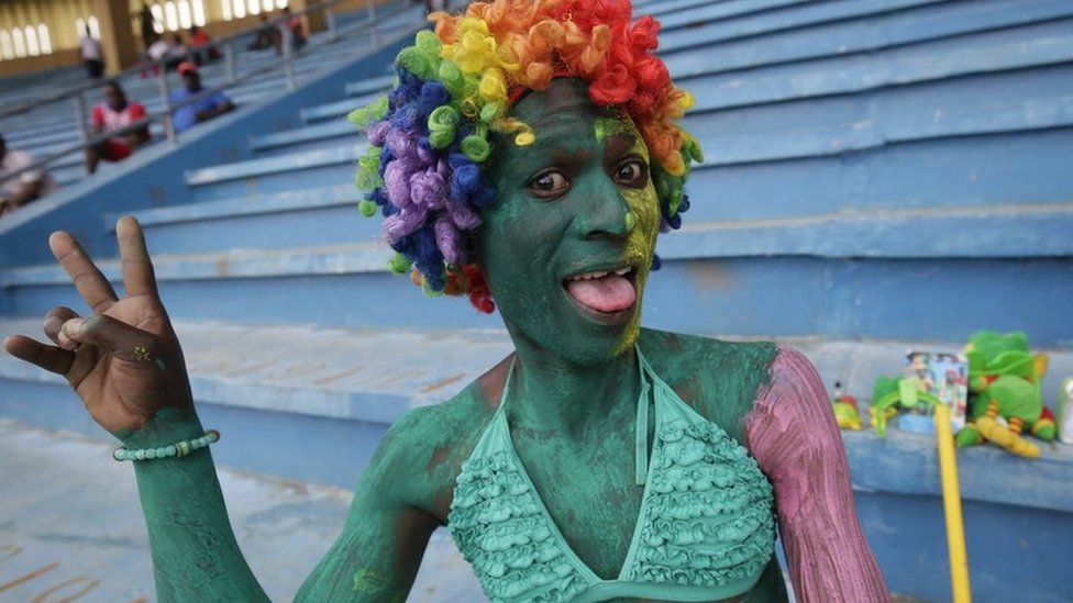 A Congolese fan cheers before the start of the 2019 AFCON group G qualifier match between Liberia and Congo at the Samuel Kanyon Doe Sports Complex in Paynesville, outside Monrovia, Liberia