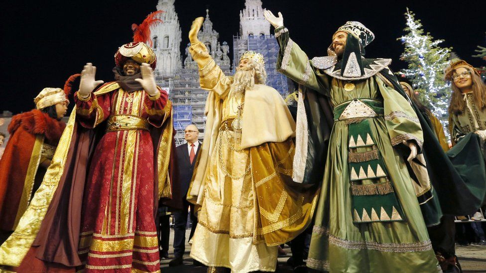 The Three Wise Men Mechor (C), Gaspar (R) and Baltasar (L) greet people during procession in Madrid on 5 January