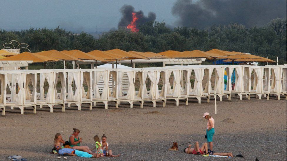 The aftermath of explosions in Crimea is seen on a beach