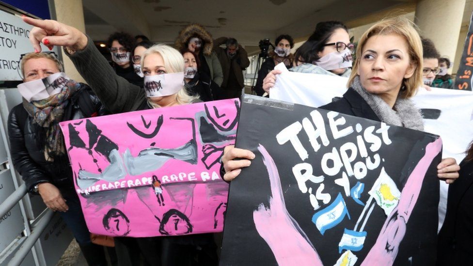 Women's right activists stage a protest outside the court