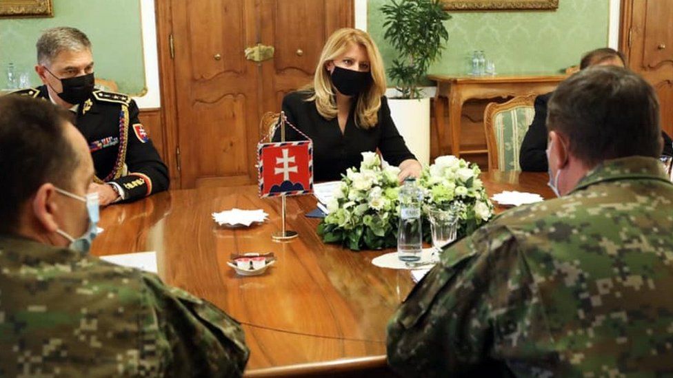 President Caputova (C) with army chiefs