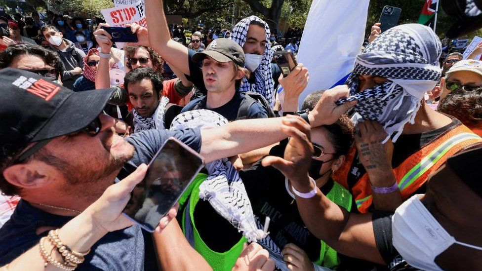 Protesters successful  enactment    of Palestinians successful  Gaza and pro-Israel counter-protesters scuffle during demonstrations astatine  the University of California Los Angeles (UCLA) successful  Los Angeles, California