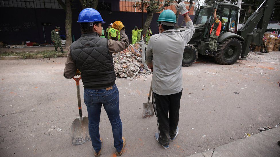 Workers were regularly interrupted from clearing debris by shouts of "¡silencio!" as rescuers used sensitive instruments to try and find victims of the 7.1 magnitude earthquake, Mexico City, 20 September 2017